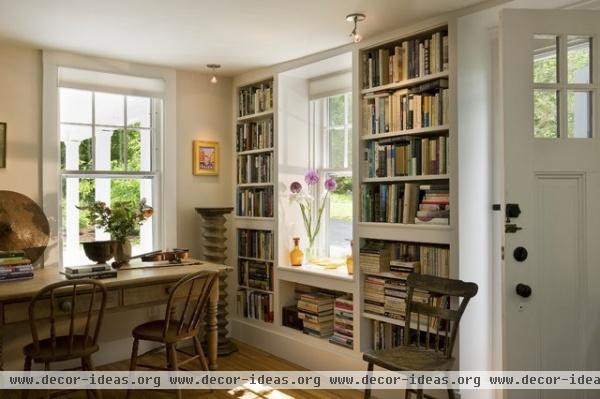 Bookcases flanking window - traditional - living room - burlington