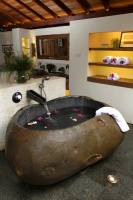 River Rock Bath Tub with Wall Mounted Faucet. - tropical - bathroom - other metro