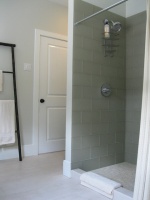 Guest bathroom with glass tile, marble penny tile and Relvinha limestone floor - asian - bathroom -