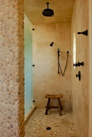 Pebble texture and stone Master Shower - tropical - bathroom - charleston