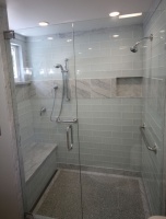 Carrera Marble combined with White Glass creates a transitional bath - traditional - bathroom - hawaii