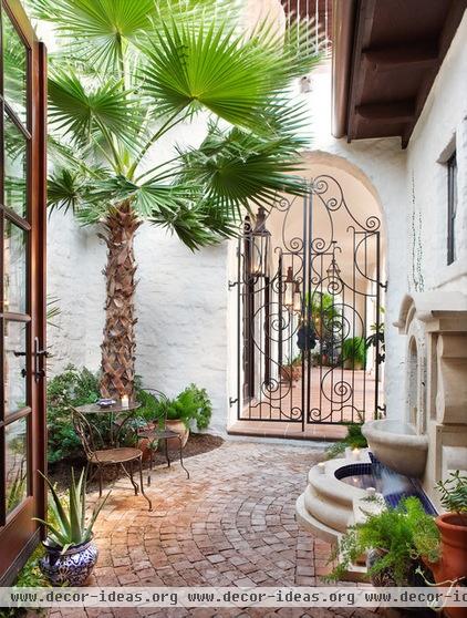 mediterranean patio by Cornerstone Architects