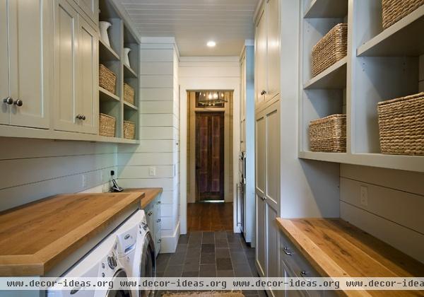 traditional laundry room by The Berry Group