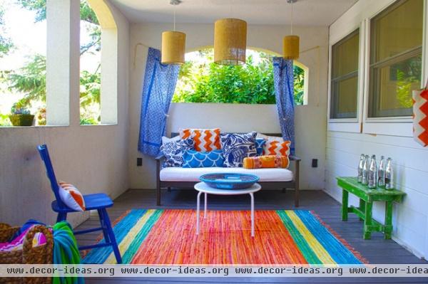 eclectic porch by G Family, Inc.