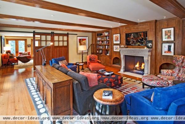 transitional family room by Root Construction