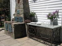 A 1920s Grill Inspires a Patinated Patio