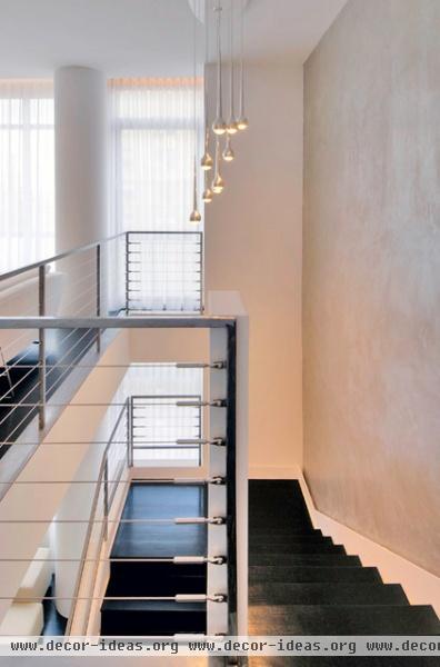 modern staircase by West Chin Architects & Interior Designers