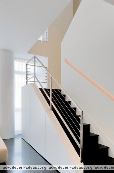 modern staircase by West Chin Architects & Interior Designers