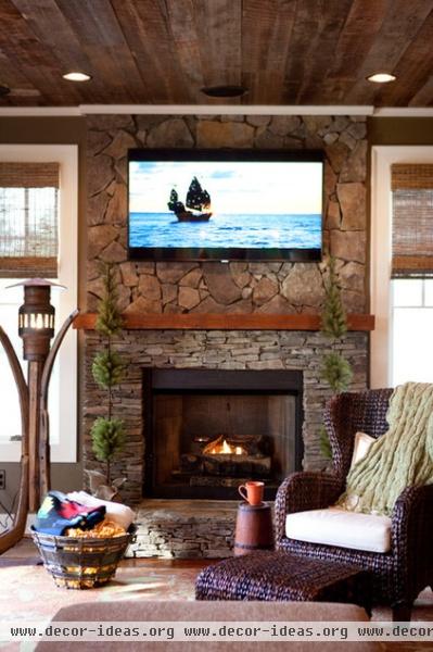 rustic living room by C.H.I. Construction, Inc.