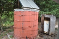 See an Outdoor Bathroom Made From a Water Tank