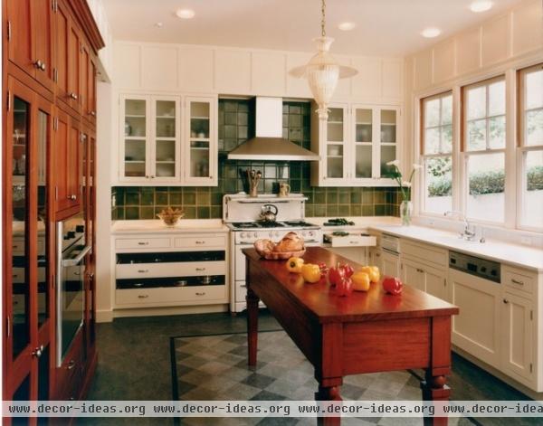 mediterranean kitchen by Mueller Nicholls Cabinets and Construction