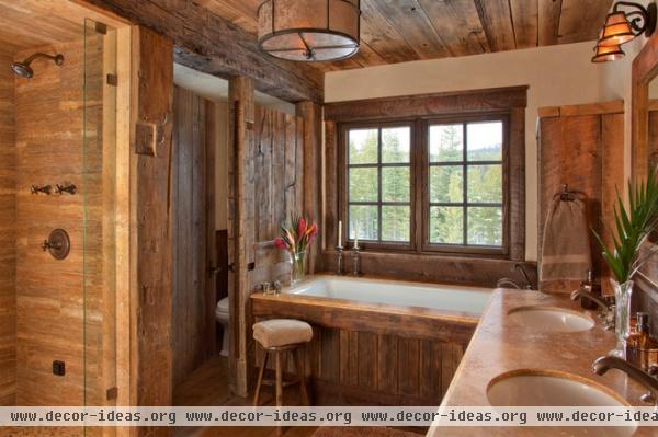 rustic bathroom by Lohss Construction