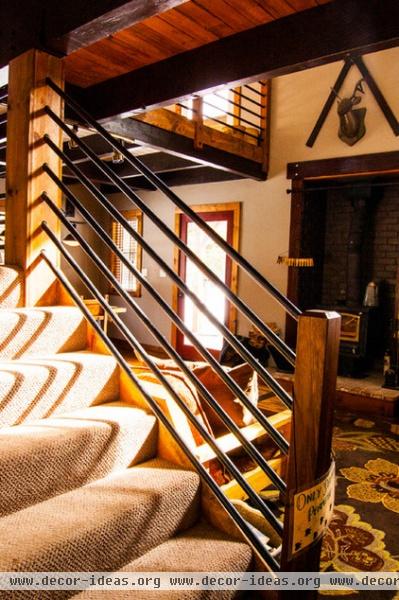 rustic staircase by J. Tight Interiors