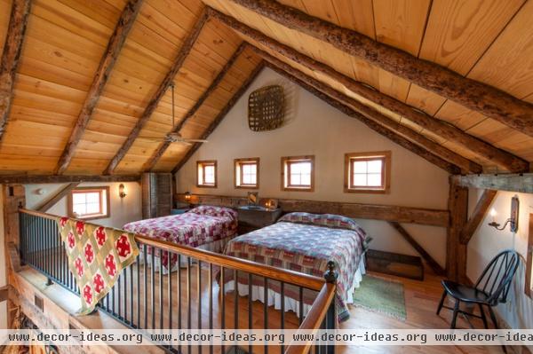 rustic bedroom by HeritageBarns.com