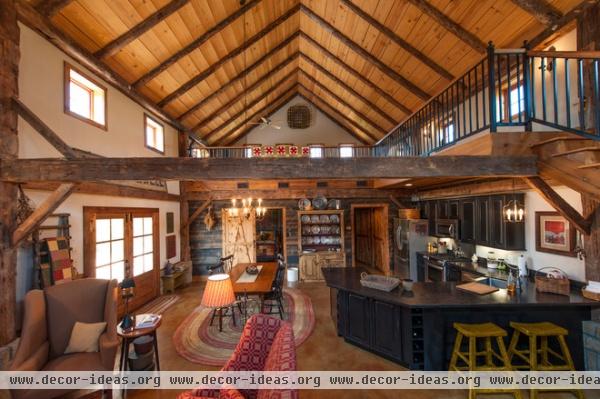 rustic living room by HeritageBarns.com