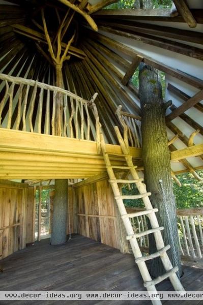 tropical garage and shed by Hugh Lofting Timber Framing, Inc.