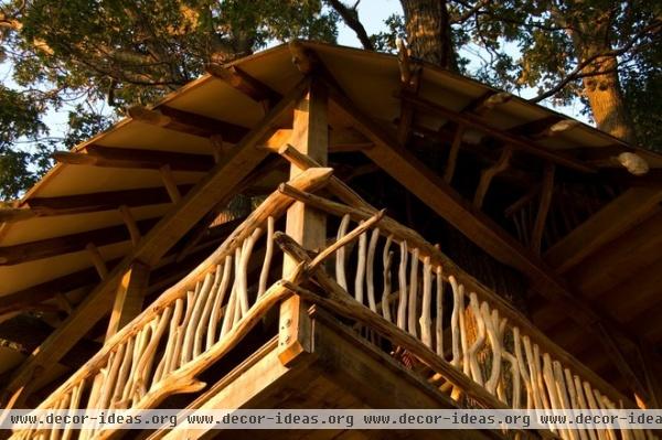 tropical garage and shed by Hugh Lofting Timber Framing, Inc.