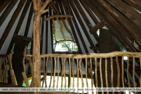 tropical garage and shed by Hugh Lofting Timber Framing, Inc.