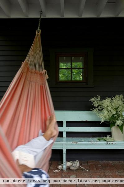 rustic porch by Jean Longpré