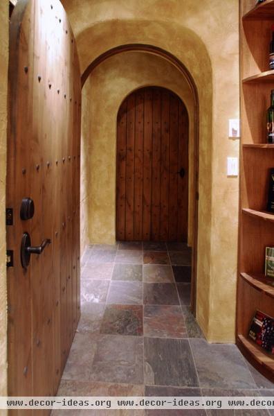 traditional wine cellar by Daniel Gordon | Renovation Artistry