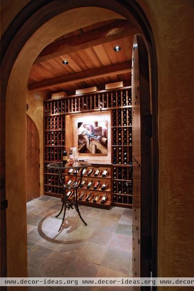 traditional wine cellar by Daniel Gordon | Renovation Artistry