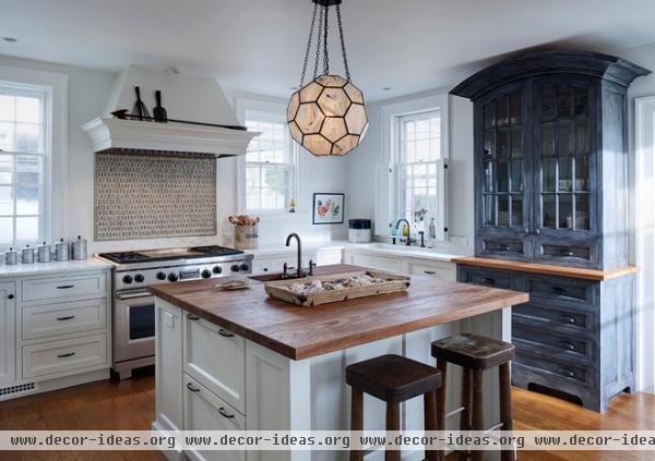 transitional kitchen by Buckingham Interiors + Design LLC