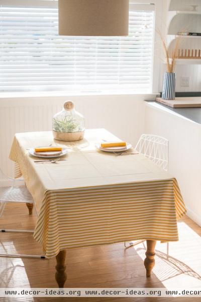 beach style dining room by Brick House Goods