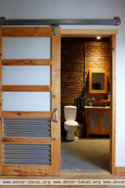 industrial bathroom by Esther Hershcovich