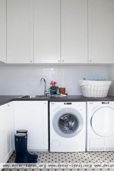 transitional laundry room by Horton & Co. Designers