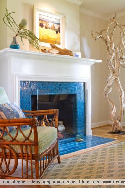 beach style living room by Charmean Neithart Interiors, LLC.