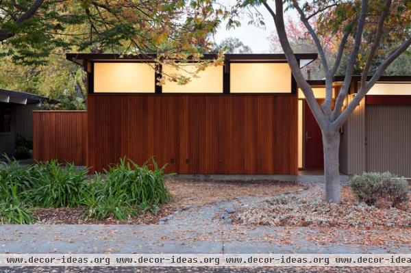 midcentury exterior by Klopf Architecture