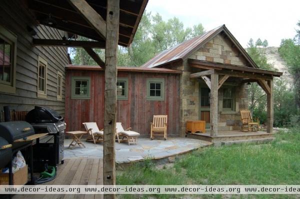 rustic porch by Coburn Development