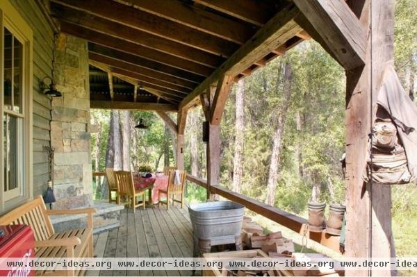 rustic porch by Coburn Development