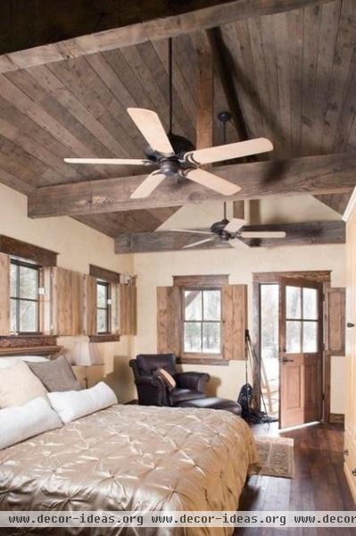 rustic bedroom by Coburn Development