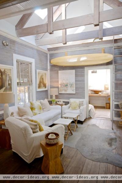 beach style family room by Starr Sanford Design