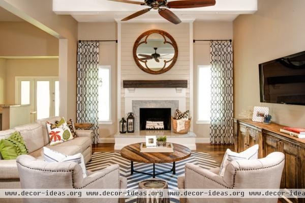 rustic family room by J & J Design Group, LLC.