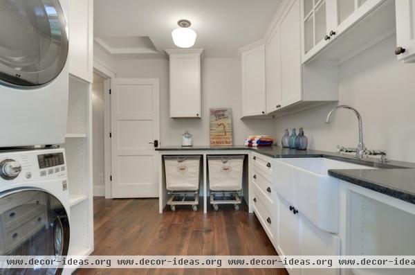 transitional laundry room by Divine Custom Homes