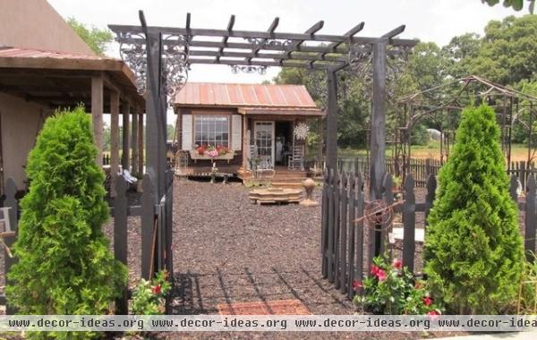 eclectic garage and shed by Iron Accents