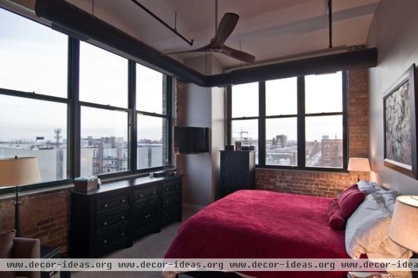 industrial bedroom by Besch Design, Ltd.