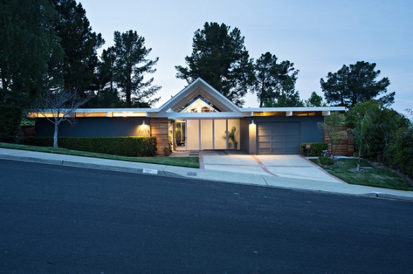 midcentury exterior by Klopf Architecture