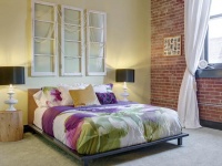 Bedroom with Platform Bed and Exposed Brick Walls : Designers' Portfolio