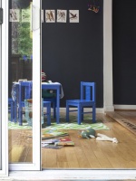 Black Playroom With Sliding Glass Doors & Blue Kids' Chairs : Designers' Portfolio