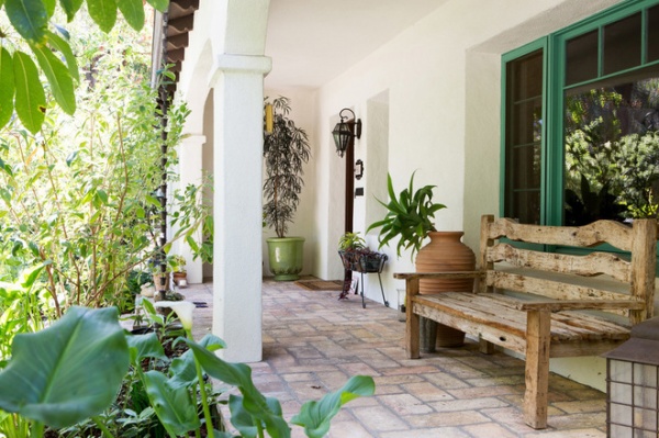 mediterranean porch by Charmean Neithart Interiors, LLC.