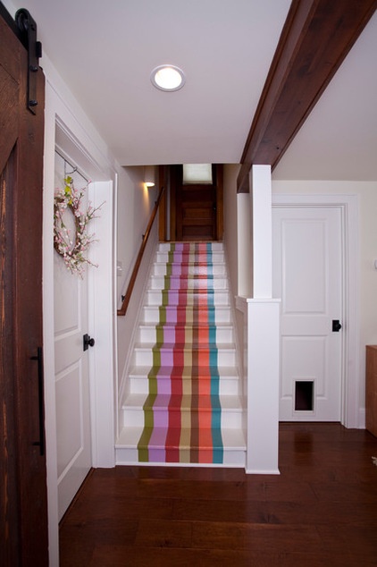 eclectic staircase by TreHus Architects+Interior Designers+Builders