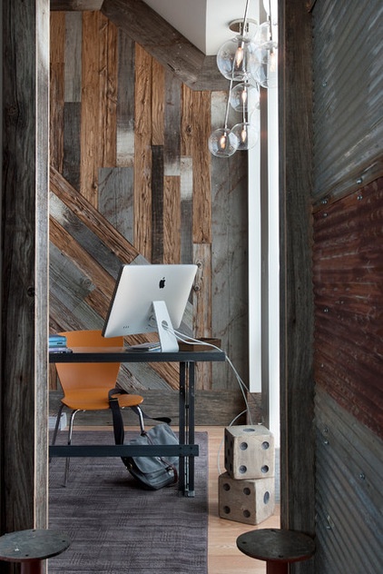 industrial home office by Groundswell Design Group, LLC