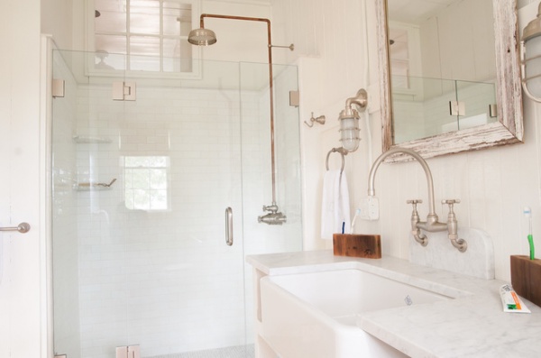 beach style bathroom by allee architecture + design, llc