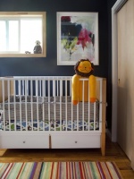Contemporary Nursery With Blue-Gray Walls, Crib & Stuffed Yellow Lion Doll : Designers' Portfolio