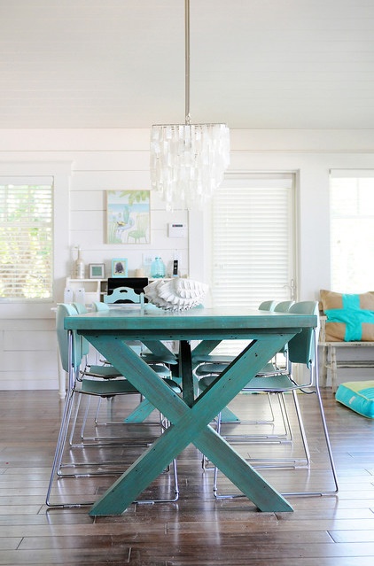 beach style dining room by The Blue Moon Trading Company