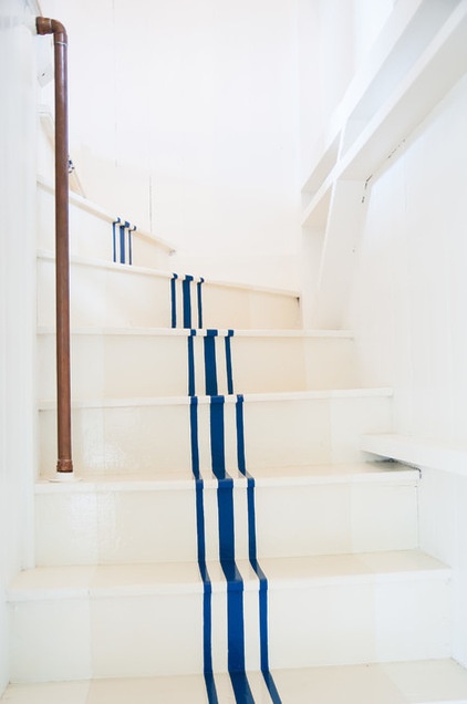 beach style staircase by allee architecture + design, llc