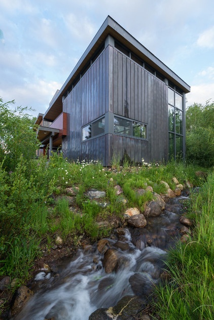 Rustic Exterior by Valdez Architecture - Interiors